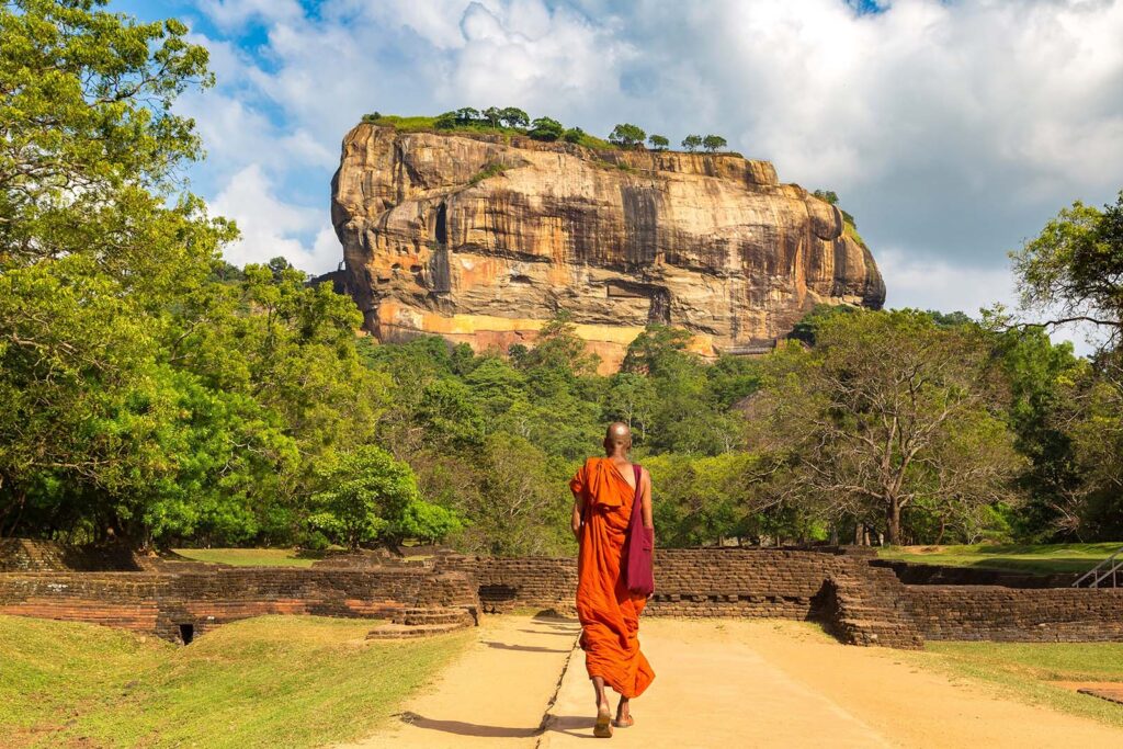 A monk walking near Lion Rock Sri Lanka